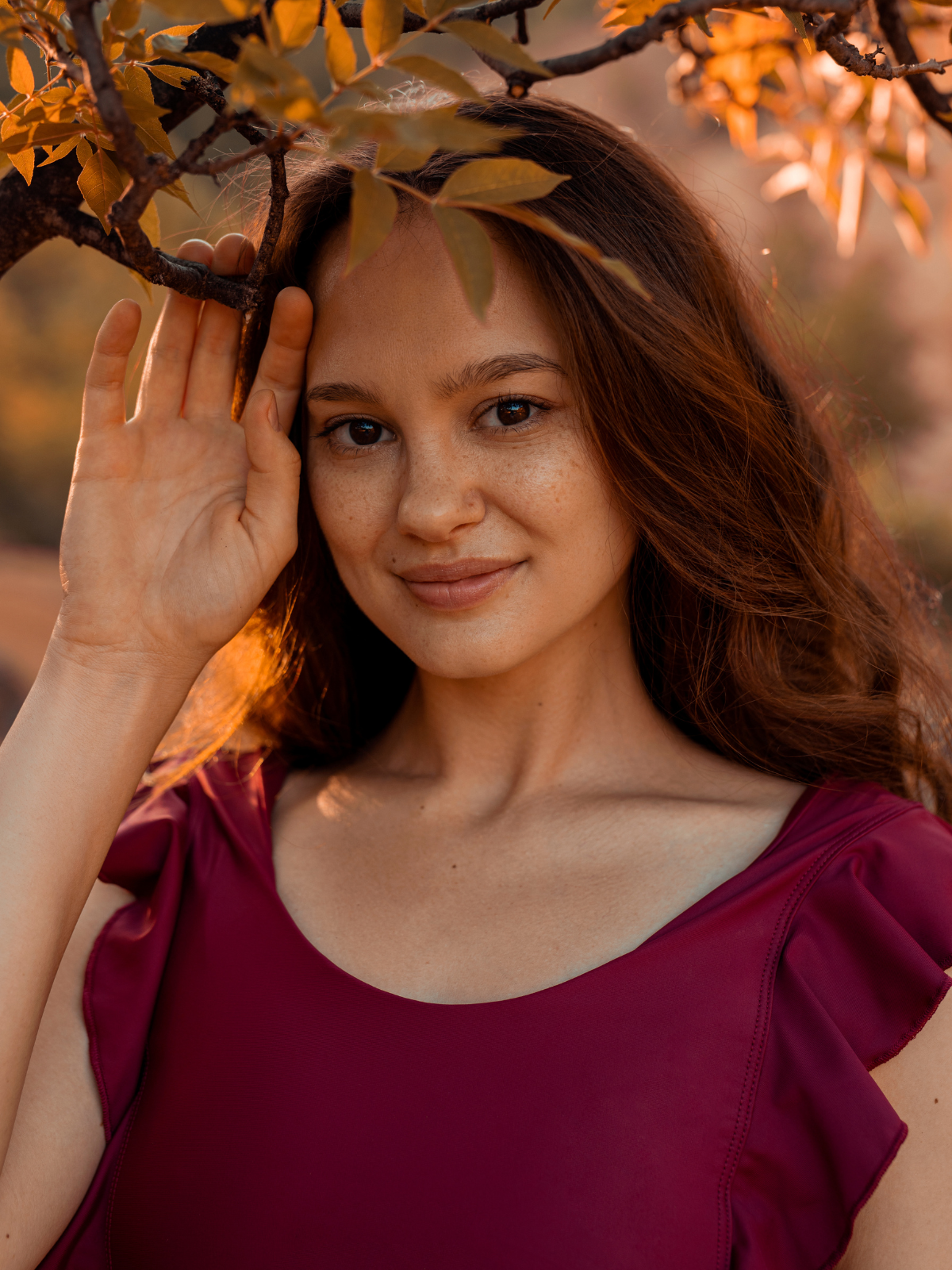 woman wearing burgundy flowy clothes